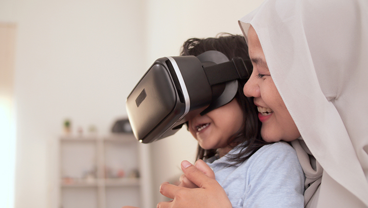 Mother-and-daughter-using-virtual-reality-headset